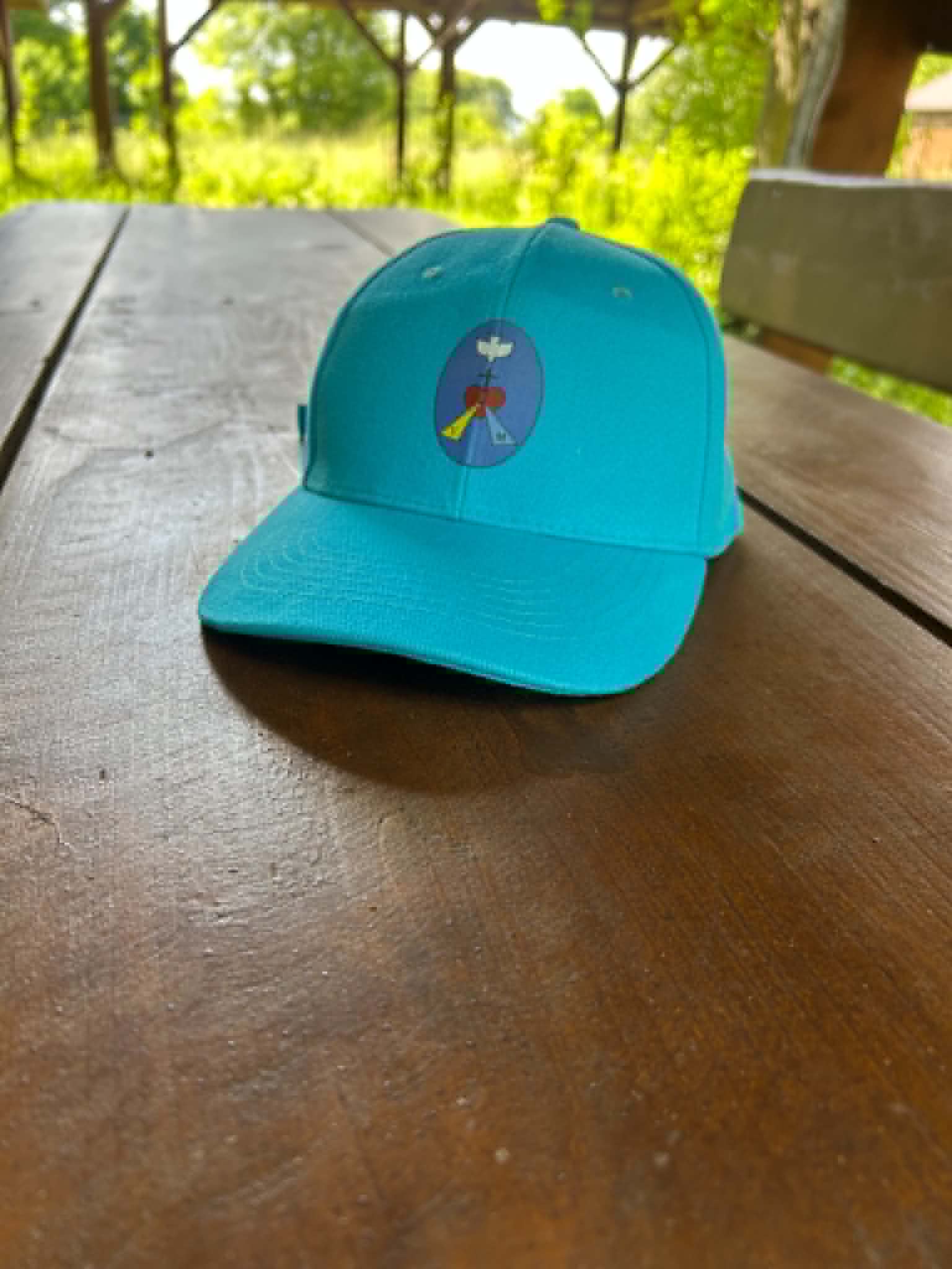 Czapka z daszkiem z logo Wspólnoty MiMJ – turkus